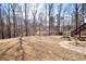 A tranquil backyard setting surrounded by mature trees offers privacy and natural beauty at 3405 Lake Valley Way, Douglasville, GA 30135