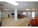 Spacious basement with plush carpet, fireplace and a walk-out to patio offers ample entertaining space at 3405 Lake Valley Way, Douglasville, GA 30135