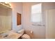 Neutral bathroom with a built-in tub/shower combination and window for natural light at 3405 Lake Valley Way, Douglasville, GA 30135