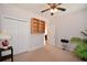 Neutral bedroom with a ceiling fan, closet, and an abundance of natural light at 3405 Lake Valley Way, Douglasville, GA 30135