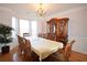 Formal dining room featuring a large table, china cabinet, and bay window at 3405 Lake Valley Way, Douglasville, GA 30135