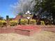 Community entrance with a brick sign reading 'GREYTHORNE' and well-maintained landscaping at 3405 Lake Valley Way, Douglasville, GA 30135
