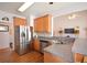Modern kitchen featuring stainless steel appliances, light wood cabinetry and hardwood floors at 3405 Lake Valley Way, Douglasville, GA 30135