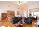 Open-concept living room with hardwood floors, high ceilings, and elegant furnishings at 3405 Lake Valley Way, Douglasville, GA 30135