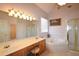 Well-lit bathroom with double sinks, a soaking tub, and a separate glass-enclosed shower at 3405 Lake Valley Way, Douglasville, GA 30135