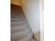 Carpeted stairway with white railing at 3405 Lake Valley Way, Douglasville, GA 30135