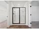 Bathroom featuring a glass enclosed shower, wood look floors and white paint at 3545 Bexton Dr, Duluth, GA 30097