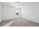 A cozy bedroom features neutral carpet, and a window providing natural light at 3545 Bexton Dr, Duluth, GA 30097