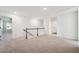 Loft area with carpeted floors and access to multiple rooms at 3545 Bexton Dr, Duluth, GA 30097
