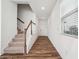 Inviting entryway featuring wood floors, a staircase with white railings, and a bright, open feel at 3545 Bexton Dr, Duluth, GA 30097