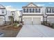 New townhome with a two-car garage, white siding, and well-maintained landscaping for an inviting appearance at 3545 Bexton Dr, Duluth, GA 30097
