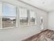 The sunroom features wood flooring, multiple windows, and a glass pane door at 3545 Bexton Dr, Duluth, GA 30097