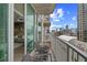 Cozy balcony with comfortable seating and stunning city views, blending indoor and outdoor living at 361 17Th Nw St # 807, Atlanta, GA 30363