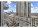 Breathtaking city views from a private balcony, perfect for relaxing and enjoying the urban landscape with seating at 361 17Th Nw St # 807, Atlanta, GA 30363