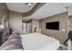 Spacious main bedroom with a large flat screen TV, a king size bed, and an ensuite bathroom in view at 361 17Th Nw St # 807, Atlanta, GA 30363