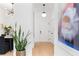 Inviting entryway with a modern light fixture and artwork at 567 Ponce De Leon Ne Ave # 510, Atlanta, GA 30308