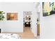 Bright hallway leads to an open kitchen with bar seating and modern appliances, showcasing the home's layout at 567 Ponce De Leon Ne Ave # 510, Atlanta, GA 30308