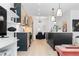 Contemporary kitchen design with sleek cabinets, a center island, and stylish lighting, open to dining area at 567 Ponce De Leon Ne Ave # 510, Atlanta, GA 30308