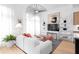 Modern living room with stylish decor, including a sleek entertainment center, unique lighting, and comfortable seating at 567 Ponce De Leon Ne Ave # 510, Atlanta, GA 30308