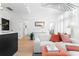 Open-concept living room with elegant furnishings, abundant natural light, and access to a private outdoor space at 567 Ponce De Leon Ne Ave # 510, Atlanta, GA 30308