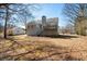 Backyard view of the home with a deck, showcasing the outdoor living space at 169 Bethnal Way, Douglasville, GA 30134