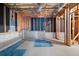 Partially finished basement with exposed wood framing and concrete walls, great for storage at 169 Bethnal Way, Douglasville, GA 30134