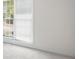 Bedroom with window letting in light and neutral-colored walls and floors at 169 Bethnal Way, Douglasville, GA 30134