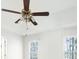Bright bedroom featuring a ceiling fan and double windows, providing ample natural light at 169 Bethnal Way, Douglasville, GA 30134