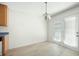 Dining area with wood floors, sliding doors and a hanging chandelier at 169 Bethnal Way, Douglasville, GA 30134