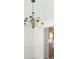 Chandelier in dining room with white walls and doorway leading to the kitchen at 169 Bethnal Way, Douglasville, GA 30134
