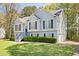 Charming two-story home with manicured lawn, three car garage, and elegant gray siding at 169 Bethnal Way, Douglasville, GA 30134