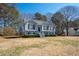 Charming two-story home with well-maintained landscaping, elegant gray siding, and mature trees at 169 Bethnal Way, Douglasville, GA 30134