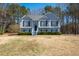 Charming two-story home with manicured lawn, elegant gray siding and well-maintained landscaping at 169 Bethnal Way, Douglasville, GA 30134