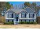 Charming two-story home with elegant gray siding, well-maintained landscaping, and inviting entrance at 169 Bethnal Way, Douglasville, GA 30134