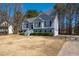 Two-story home with manicured lawn, shrubbery, and paved driveway at 169 Bethnal Way, Douglasville, GA 30134