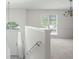 Bright living room boasts plush carpet, open layout, and abundant natural light at 169 Bethnal Way, Douglasville, GA 30134