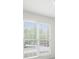Bright living room featuring a large window with blinds allowing for natural light at 169 Bethnal Way, Douglasville, GA 30134