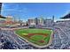 Panoramic aerial view of a modern baseball stadium with fans, city skyline in the background under a bright sky at 2428 Crescent Park Ct, Atlanta, GA 30339