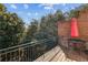 Outdoor balcony with seating and privacy from surrounding trees at 2428 Crescent Park Ct, Atlanta, GA 30339