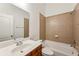 Bathroom featuring tiled shower-tub, vanity with solid surface counter, and white fixtures at 2428 Crescent Park Ct, Atlanta, GA 30339