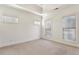 Light-filled bedroom with neutral carpet, crown moulding and multiple windows for ample sunlight at 2428 Crescent Park Ct, Atlanta, GA 30339