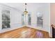 Inviting bonus room boasts hardwood floors, large windows, and neutral paint throughout the interior at 2428 Crescent Park Ct, Atlanta, GA 30339