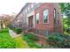 Traditional brick townhome with manicured landscaping and charming curb appeal at 2428 Crescent Park Ct, Atlanta, GA 30339