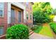 Close up of a stately red brick home with an inviting front entrance and well-maintained lawn at 2428 Crescent Park Ct, Atlanta, GA 30339