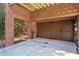 Two-car garage with brick walls and a large garage door at 2428 Crescent Park Ct, Atlanta, GA 30339