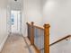Bright hallway with staircase and carpeted floor, offering a clean and modern aesthetic at 2428 Crescent Park Ct, Atlanta, GA 30339