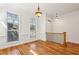 Bright living room with hardwood floors, large windows, and elegant lighting fixtures at 2428 Crescent Park Ct, Atlanta, GA 30339