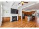 Open-concept living space with fireplace, hardwood floors, and kitchen with granite countertops at 2428 Crescent Park Ct, Atlanta, GA 30339