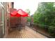 Cozy outdoor patio with a table, chairs, umbrella, and a view of lush greenery at 2428 Crescent Park Ct, Atlanta, GA 30339