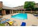 Relaxing community pool area with lounge chairs and seating, perfect for enjoying sunny days at 2428 Crescent Park Ct, Atlanta, GA 30339